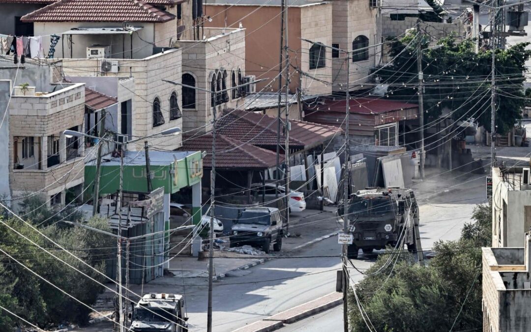 Footage shows Israeli soldier pushing body off roof in West Bank raid