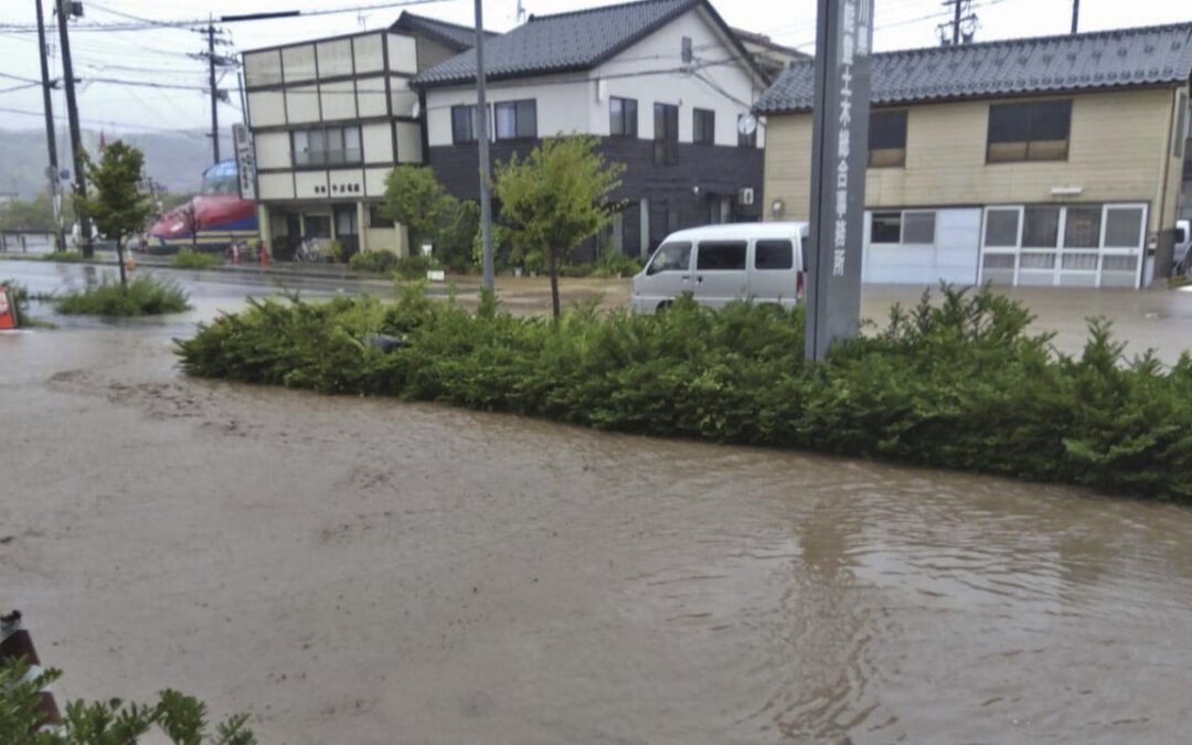 Japan orders evacuations as heavy rains trigger floods in quake-hit region