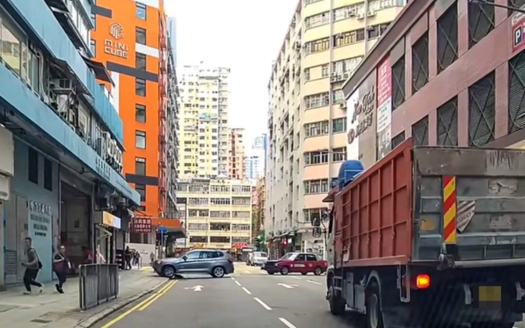 3 Hongkongers injured after BMW crashes into truck and taxi, mounts pavement on busy street