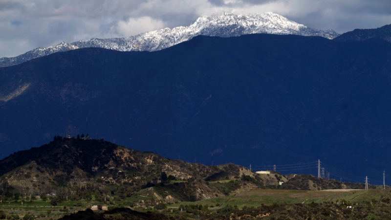 A photojournalist is fatally stabbed on a California trail. His teen son is charged in his death