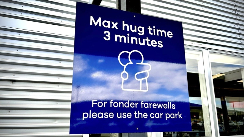 New Zealand airport imposes cuddle cap with 3-minute limit on goodbye hugs to avoid traffic jams