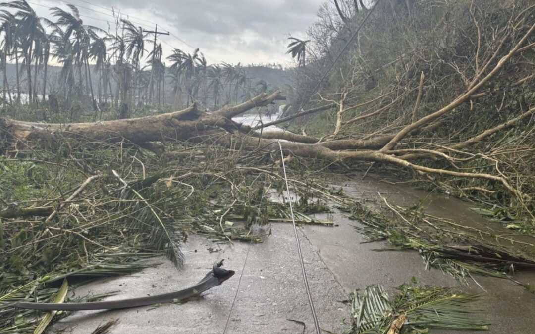 Super Typhoon Man-Yi weakens as it sweeps through the Philippines