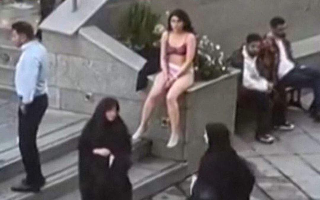 Iran says no charges against student who stripped to her underwear