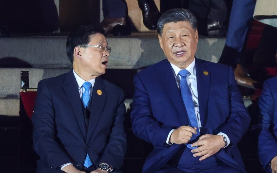 Xi Jinping gives encouragement to Hong Kong leader in talks at Apec summit sidelines