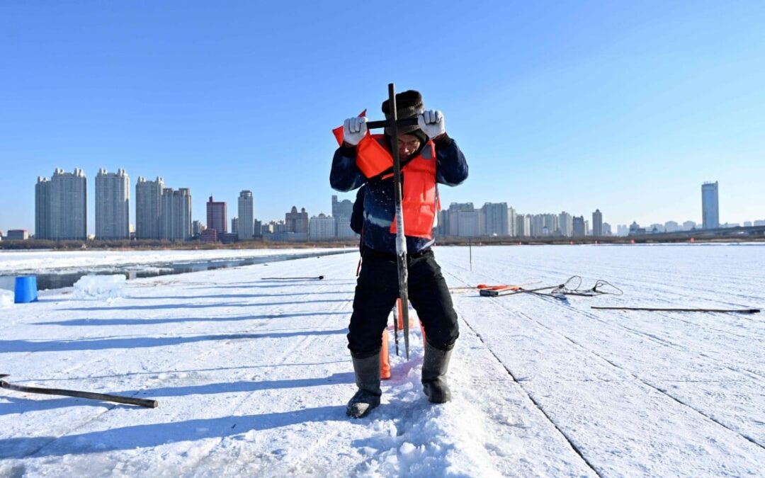 Harbin river ice cutters feel the heat as warm autumn affects their bottom line