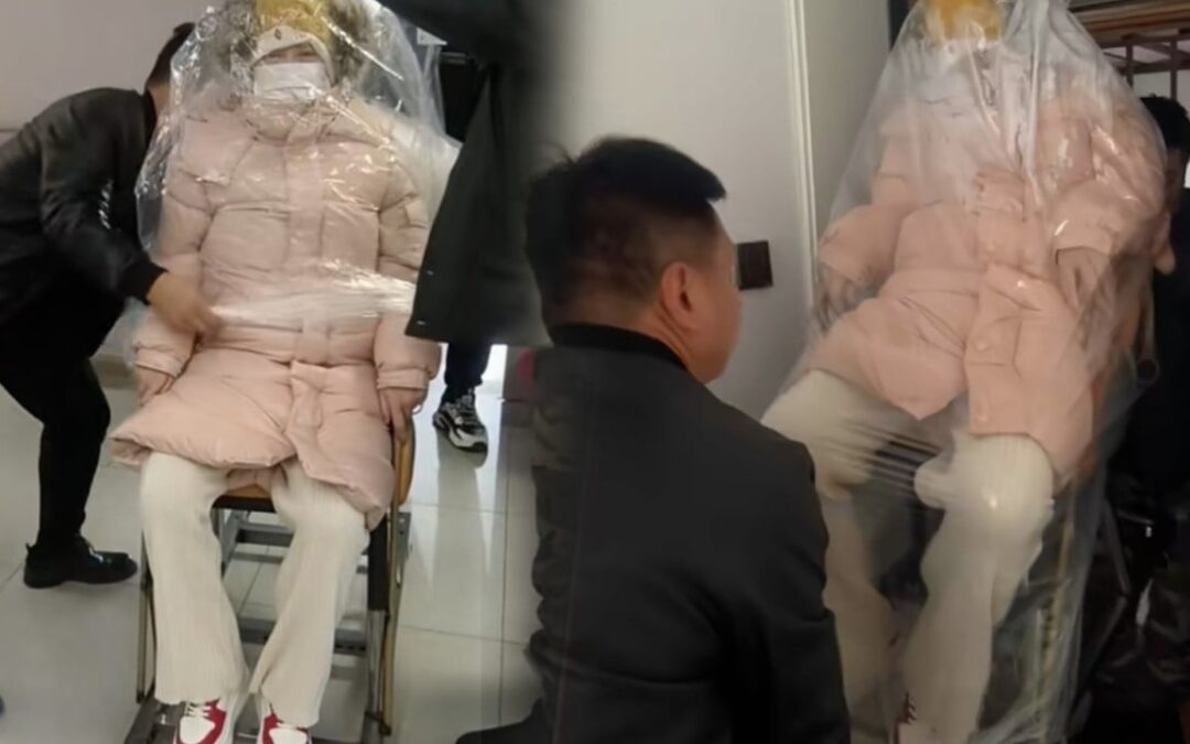 Chinese woman wrapped in large plastic bag after hospital discharge post-childbirth – but why?