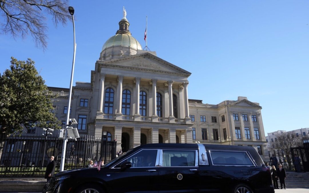 Carter’s flag-draped casket arrives in Atlanta as 39th US president’s state funeral begins