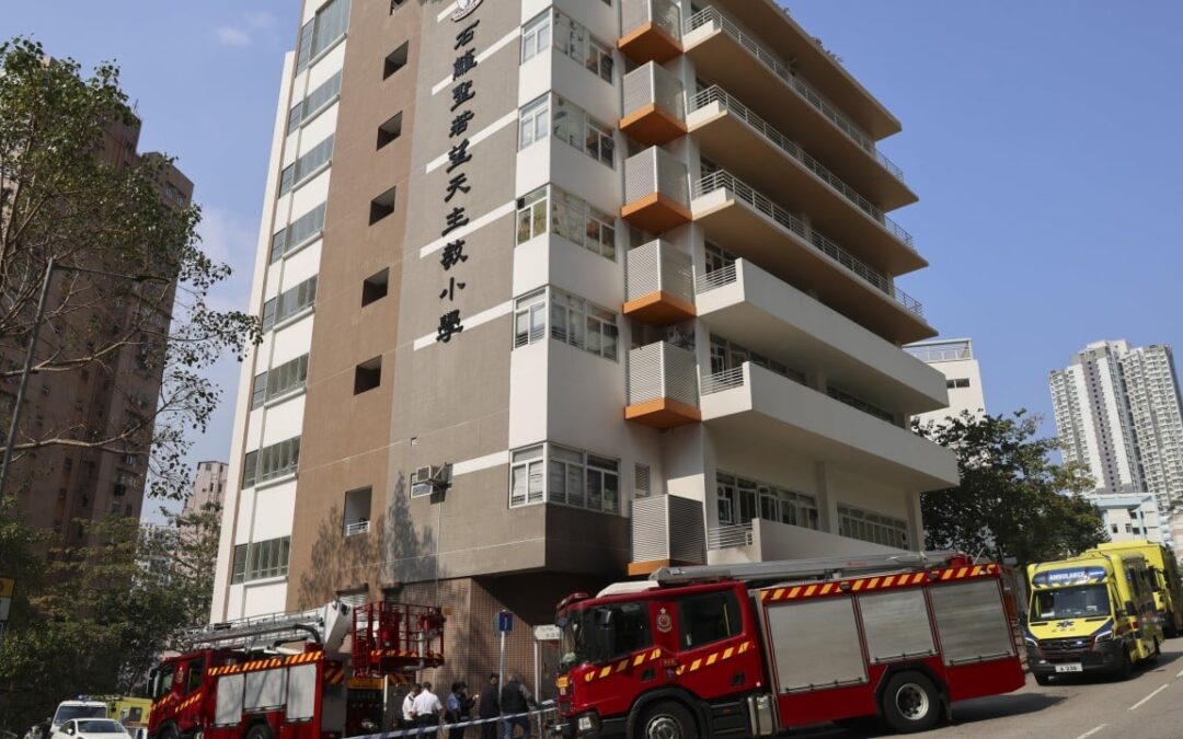 20 Hong Kong students hospitalised after trolley set ablaze outside school