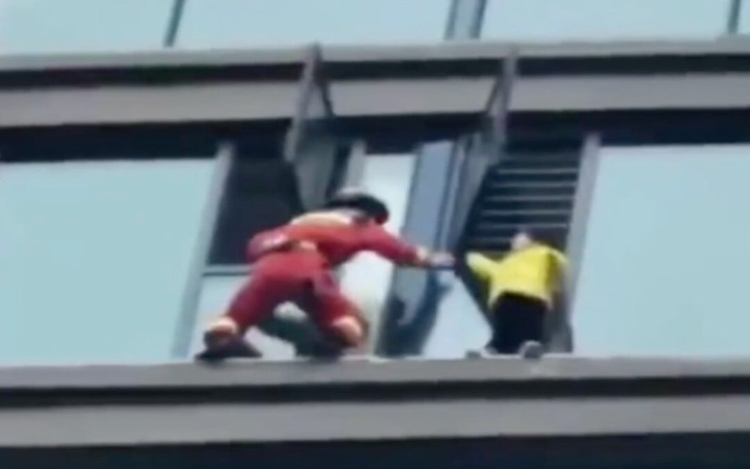 Chinese girl rescued after being stranded on window ledge